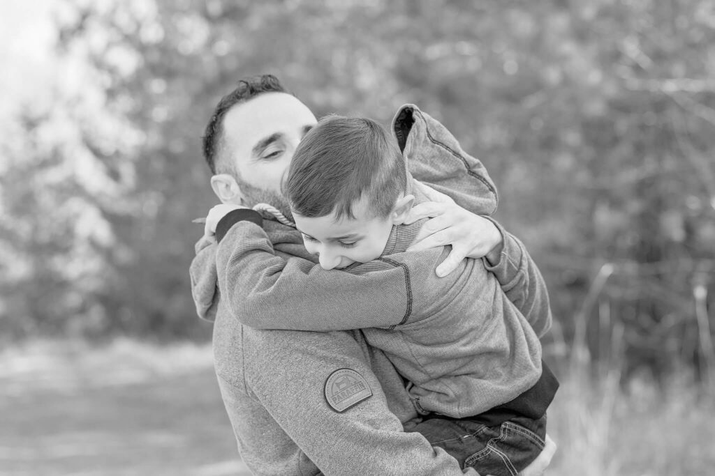Father and son embracing during a photo session